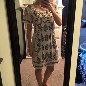 Beaded cream and black floral dress.